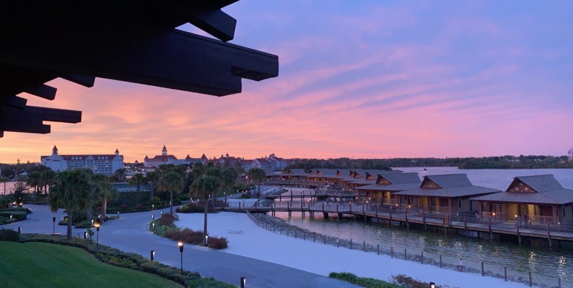 Disney DVC Polynesian view of water bungalows at sunset