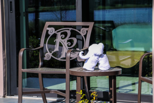 Disney DVC Riviera guest suite patio with towel animal